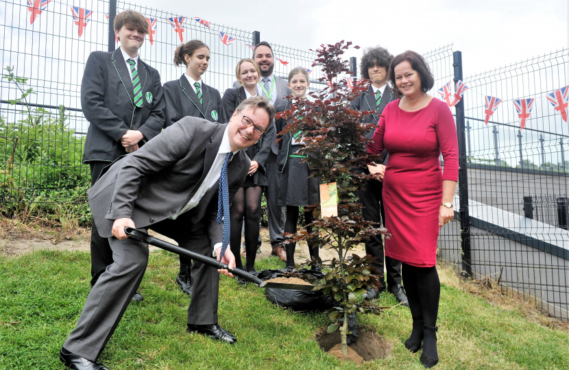 Jonathan Lord MP planting tree with Hoe Valley students 