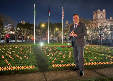 Jonathan Lord MP places a tribute on behalf of Woking in Westminster's Garden of Remembrance